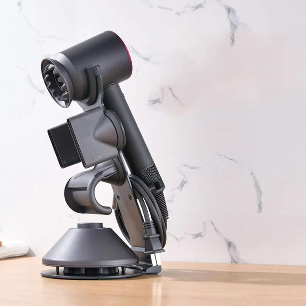 Pöytäjalusta Dyson Supersonic-hiustenkuivaajalle, jossa on magneettinen suuttimen pidike