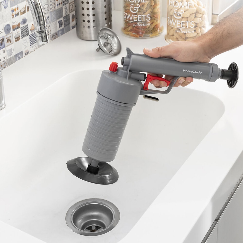 Paineilmapistooli viemärin puhdistukseen yleissovittimilla ja kemikaalivapaaseen puhdistukseen