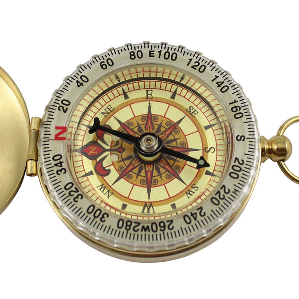 Itsevalaiseva kullanvärinen kompassi